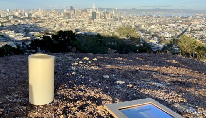A solemn candle and a photograph where the monolith once stood.  Photo: Sergio Quintana / @svqjournalist, NBC News